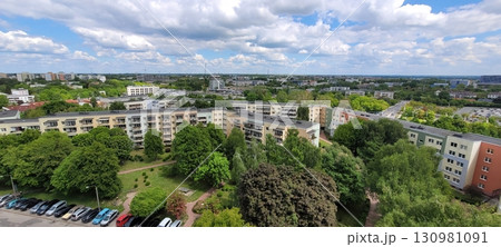 A beautiful, scenic urban landscape showcasing lush greenery alongside striking modern architecture 130981091