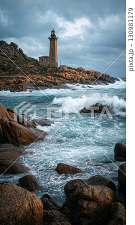 Old lighthouse rocky coast stormy weather ocean wave dramatic sky rugged landscape Old lighthouse rocky coast stormy weather ocean wave dramatic sky rugged landscape 130981179