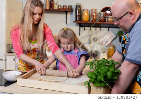 Enjoying Family Cooking Together in the Kitchen, Creating Memorable Experiences and Joy Enjoying Family Cooking Together in the Kitchen, Creating Memorable Experiences and Joy 130981427