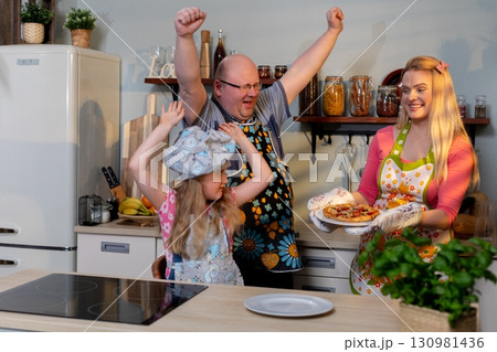 Enjoy delightful family moments in the kitchen, cooking, baking, and bonding over meals 130981436