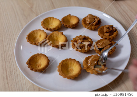 Delicious Mini Tarts Filled with Sweet and Flavorful Fillings Ready for You to Enjoy Soon Delicious Mini Tarts Filled with Sweet and Flavorful Fillings Ready for You to Enjoy Soon 130981450
