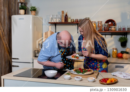 Cooking Together A Joyful Culinary Experience That Brings People Closer and Fosters Happiness Cooking Together A Joyful Culinary Experience That Brings People Closer and Fosters Happiness 130981630