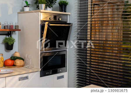 Contemporary Kitchen Design Featuring a Double Oven and Stylish, Elegant Decor Elements 130981675