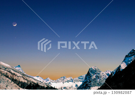 star trails in the mountains snow falling in the mountains 130982087