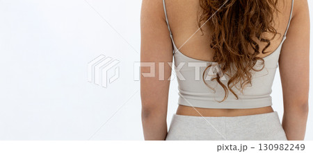 Casual Fashion Captured Back View of Model Wearing a Stylish and Comfortable Outfit Casual Fashion Captured Back View of Model Wearing a Stylish and Comfortable Outfit 130982249