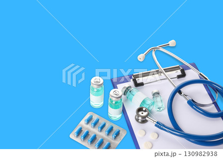 Stethoscope vials and medication arranged neatly on a clipboard 130982938