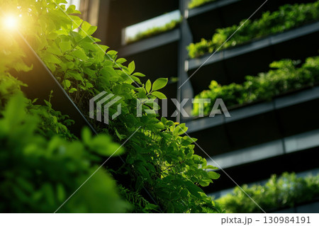 An industrial plant with green rooftops and vertical gardens promoting sustainability 130984191
