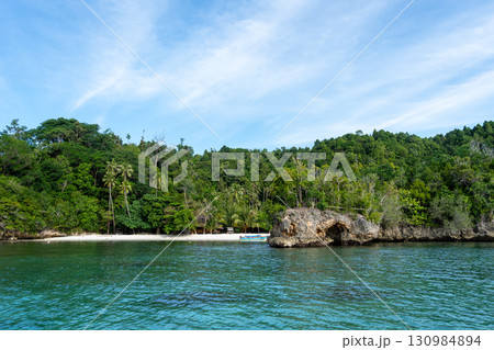 Pirogue on Lia beach, Waleakodi Island, Togian archipelago, Sulawesi, Indonesia Pirogue on Lia beach, Waleakodi Island, Togian archipelago, Sulawesi, Indonesia 130984894