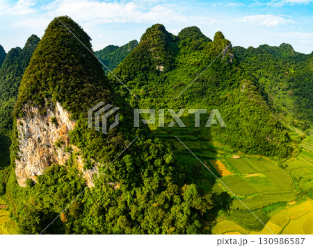 Drone aerial view of landscape mountains view in sunrise or sunset time,High angle view over countryside at northern Vietnam Drone aerial view of landscape mountains view in sunrise or sunset time,High angle view over countryside at northern Vietnam 130986587