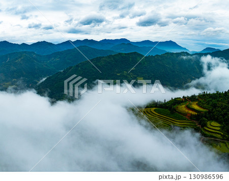 Drone aerial view of landscape mountains view in sunrise or sunset time,High angle view over countryside at northern Vietnam Drone aerial view of landscape mountains view in sunrise or sunset time,High angle view over countryside at northern Vietnam 130986596