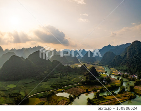 Drone aerial view of landscape mountains view in sunrise or sunset time,High angle view over countryside at northern Vietnam Drone aerial view of landscape mountains view in sunrise or sunset time,High angle view over countryside at northern Vietnam 130986624