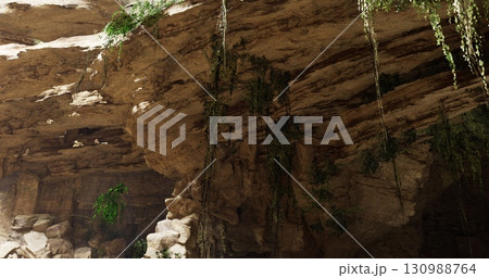 A limestone cave with towering rock formations and hanging vines reveals a serene atmosphere filled with natural light. The vibrant greenery adds a touch of life to the rugged landscape. A limestone cave with towering rock formations and hanging vines reveals a serene atmosphere filled with natural light. The vibrant greenery adds a touch of life to the rugged landscape. 130988764