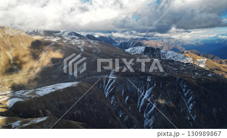 The Splendor of the Caucasus: Snowy Peaks Gleaming in Sunlight 130989867