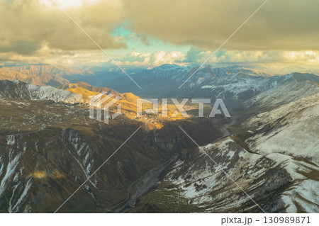 Caucasus Mountains Radiating Sunlight and Majestic Charm 130989871