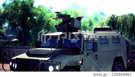 Strategically positioned in a vibrant landscape, the armored vehicle showcases cutting edge technology. The sun shines brightly, highlighting its impressive design amidst natural surroundings. Strategically positioned in a vibrant landscape, the armored vehicle showcases cutting edge technology. The sun shines brightly, highlighting its impressive design amidst natural surroundings. 130989962