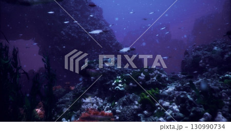 Colorful schools of fish swim gracefully through a mystical coral reef. Sunlight filters down, illuminating the underwater landscape filled with diverse flora and fauna. 130990734