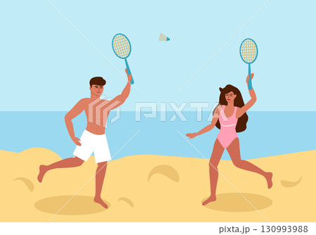 Young couple playing badminton on the beach Young couple playing badminton on the beach 130993988