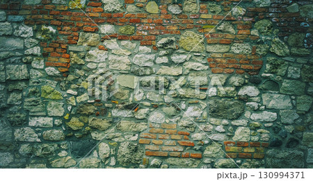 wall of an old building from cobblestones toned close up 130994371