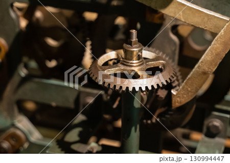 cogwheel gear vintage steel part of the mechanism close-up 130994447