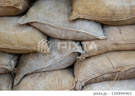 protective structure made of sandbags, for protection close-up background 130994463