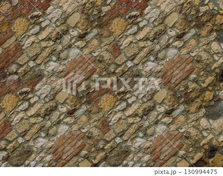 stone wall old and weathered oblique background close-up part of building stone wall old and weathered oblique background close-up part of building 130994475