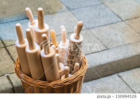 wicker basket with door rolling pins with a pattern to create an autumn pattern wicker basket with door rolling pins with a pattern to create an autumn pattern 130994526