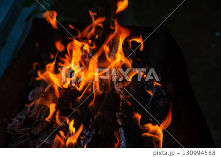 burning bonfire with a bright flame in the darkness of the night burning bonfire with a bright flame in the darkness of the night 130994588