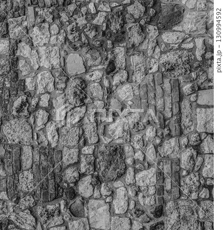 gray stone background of stacked cobblestones upright pattern closeup gray stone background of stacked cobblestones upright pattern closeup 130994592