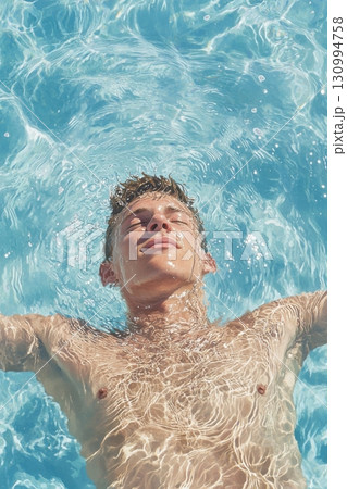 Swimmer in calm water embodies tranquility and relaxation under bright sunlight 130994758