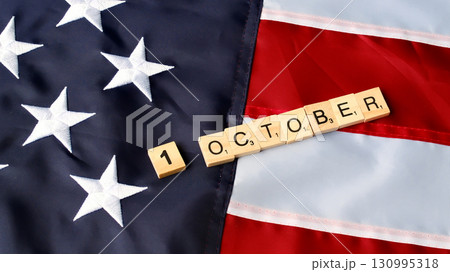 1 October wooden blocks word on American Flag 130995318