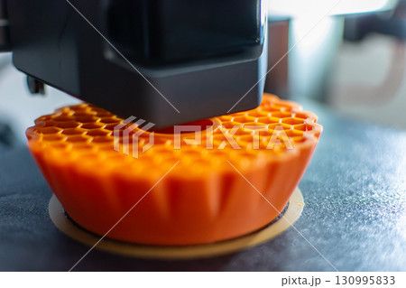 3d printer printing an object on the tray with pla filament, corn starch, non-waterproof filament 130995833