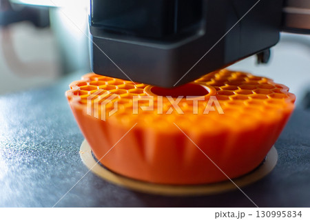 3d printer printing an object on the tray with pla filament, corn starch, non-waterproof filament 130995834