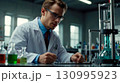 Scientist Conducts Experiment with Chemical Substances 130995923
