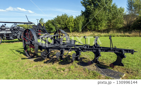 Nitra, Slovakia - September 4, 2025: A vintage mechanical plow on display at the Nitra Agricultural University. Nitra, Slovakia - September 4, 2025: A vintage mechanical plow on display at the Nitra Agricultural University. 130996144