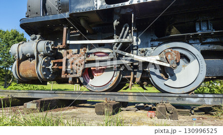 Nitra, Slovakia - September 4, 2025: A vintage miniature steam locomotive on display at Nitra Agricultural University. Close-up. 130996525