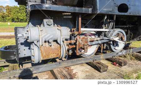 Nitra, Slovakia - September 4, 2025: Vintage miniature steam locomotive on display at the Nitra Agricultural University. Close-up. Nitra, Slovakia - September 4, 2025: Vintage miniature steam locomotive on display at the Nitra Agricultural University. Close-up. 130996527