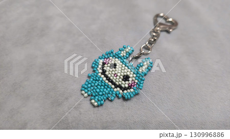 Fashionable handmade keychain toy labubu made of beads, glass beads Copy space 130996886