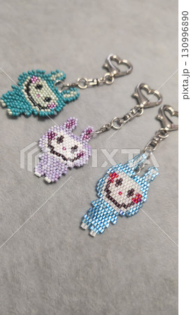 Fashionable handmade keychain toy labubu made of beads, glass beads Copy space 130996890
