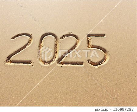 Christmas inscription 2025 on a summer beach. 130997285