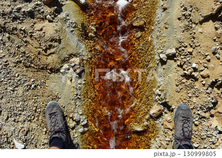 Acid mine water drainage flow, toxic mine waters polluting the environment Acid mine water drainage flow, toxic mine waters polluting the environment 130999805