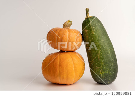 Harvested pumpkins and zucchini creating autumnal still life 130999881