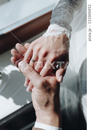 Bride and Groom Hand Hold Close-Up Bride and Groom Hand Hold Close-Up 131000852