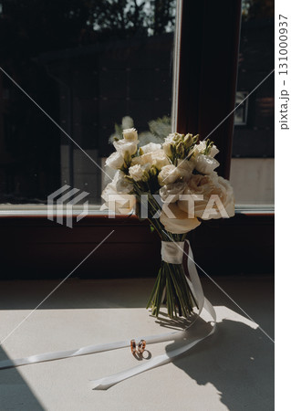 Brides Bouquet and Rings on Window Sill Brides Bouquet and Rings on Window Sill 131000937