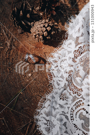 Wedding Rings and Lace on Tree Stump 131000943