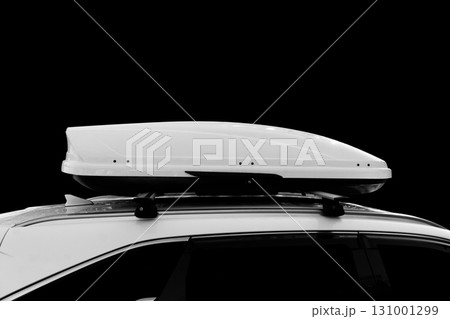 Carrier car roof box isolated. White plastic car rooftop cargo box or roof carrier for traveling. Removable storage container mounted on car roof rack. 131001299