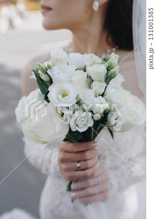 Bride with White Rose Bouquet 131001385