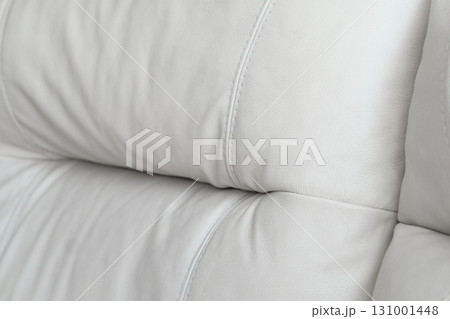 White leather texture. Part of perforated leather details. Orange perforated leather texture background. Texture, artificial leather with diagonal stitching. White leather texture. Part of perforated leather details. Orange perforated leather texture background. Texture, artificial leather with diagonal stitching. 131001448