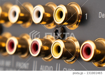RCA sockets of audio surround receiver amplifier. Macro shot Output audio connectors 131001465