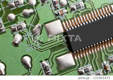 Circuit board with resistors microchips and electronic components background. Computer hardware technology. Integrated communication processor. 131001472