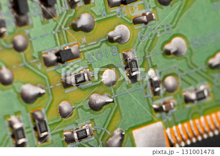 Circuit board with resistors microchips and electronic components background. Computer hardware technology. Integrated communication processor. Circuit board with resistors microchips and electronic components background. Computer hardware technology. Integrated communication processor. 131001478